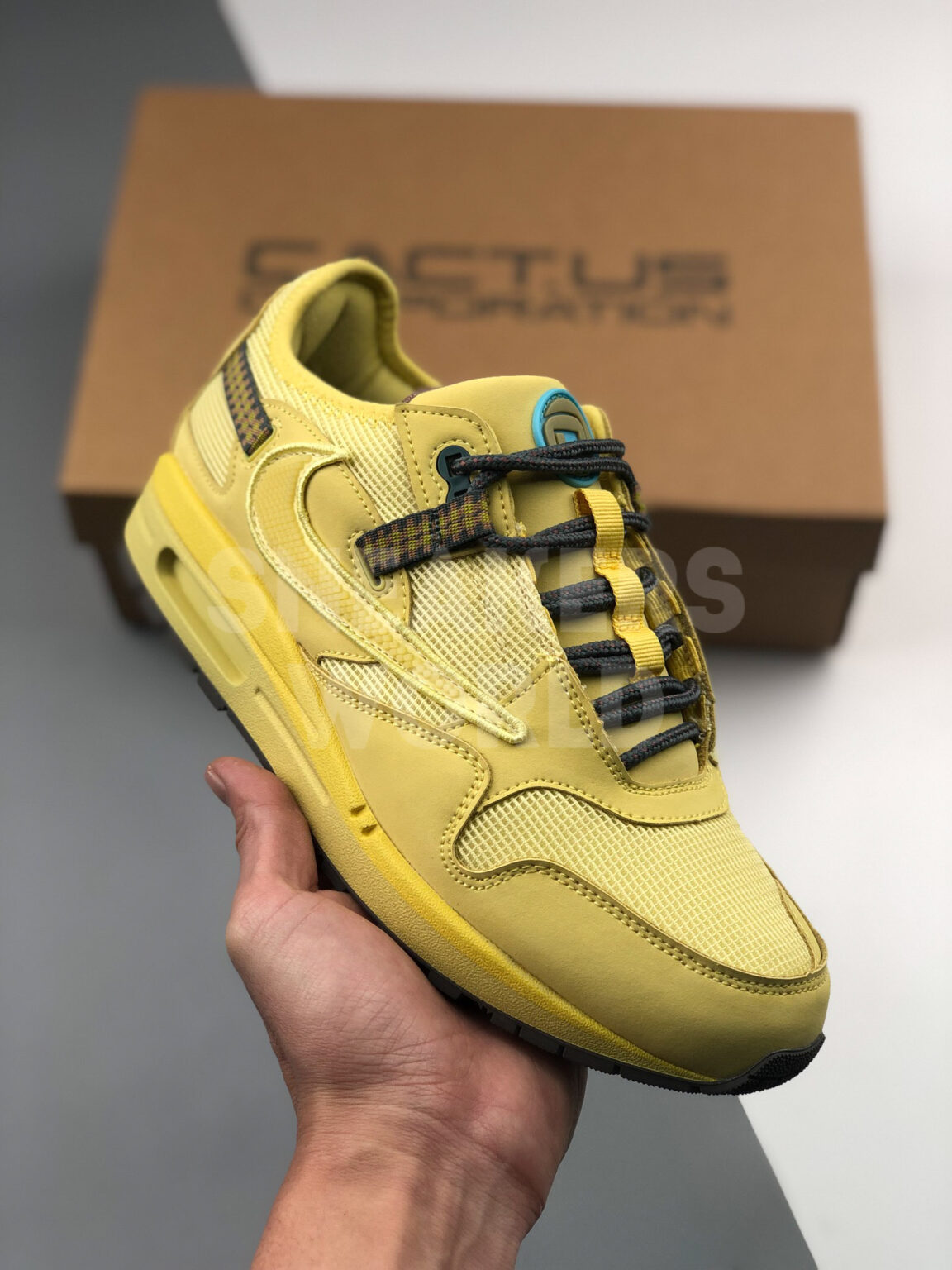 Travis Scott x Nike Air Max 1 Saturn Gold